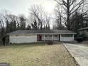 Charming ranch house with a spacious yard and driveway at 1271 Avonwood Sw Cir, Atlanta, GA 30311