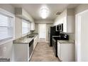 Modern kitchen with granite counters and stainless steel appliances at 1271 Avonwood Sw Cir, Atlanta, GA 30311