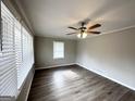 Spacious living room featuring hardwood floors and large windows at 1931 Sandringham Sw Dr, Atlanta, GA 30311