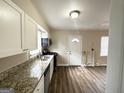 Modern kitchen with granite counters and stainless steel appliances at 490 Woods Dr, Atlanta, GA 30318