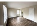 Bright living room with hardwood floors and view of kitchen at 490 Woods Dr, Atlanta, GA 30318