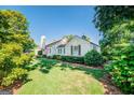 Side view of the house showcasing its classic design and landscaping at 260 Lawrenceville St, Mcdonough, GA 30253