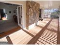 Deck with stone fireplace and access to living room at 1885 Jenny Ln, Lithia Springs, GA 30122