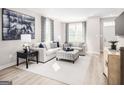 Cozy living room with neutral decor, large windows, and ample natural light at 2070 Fortuna St, Lawrenceville, GA 30046