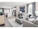 Open-concept living space with a view into kitchen, providing an ideal layout for entertaining at 2070 Fortuna St, Lawrenceville, GA 30046