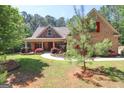 Brick house with red shutters and walkway at 900 Eskew Rd, Mcdonough, GA 30252