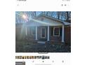 Brick ranch house with covered porch and columns at 6045 Winview Dr, Forest Park, GA 30297