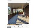 Spacious front porch with concrete flooring at 6045 Winview Dr, Forest Park, GA 30297