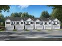 Row of stylish townhomes featuring a garage and well manicured landscaping at 325 Sound Cir # 137, Stockbridge, GA 30281