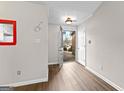 Bright entryway with sleek wood floors, neutral walls, and a glimpse of the home's exterior through the open door at 180 Lagrange Ct, Fayetteville, GA 30214