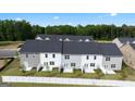 Aerial view of newly constructed townhomes features fenced yards and lush green surroundings, with back patios at 317 Sound Cir # 139, Stockbridge, GA 30281