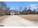 Long driveway leading to two houses in a residential area at 106 Old Gettysburg Way, Dallas, GA 30157