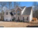Two-story house with stone accents and a two-car garage at 106 Old Gettysburg Way, Dallas, GA 30157