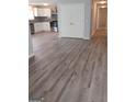 Modern kitchen featuring stainless steel appliances and grey wood-look flooring at 1059 Garibaldi Sw St, Atlanta, GA 30310