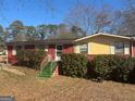 Ranch style home with red brick and yellow accents at 771 San Fernando Dr, Smyrna, GA 30080
