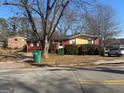 Red brick ranch home with landscaping and driveway at 771 San Fernando Dr, Smyrna, GA 30080