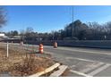 Roadway view with construction barrels at 771 San Fernando Dr, Smyrna, GA 30080