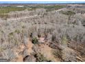 Home situated on a spacious lot; highway view in the distance at 2535 Rock Springs Rd, Buford, GA 30519