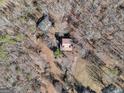 House surrounded by trees; large lot with a driveway at 2535 Rock Springs Rd, Buford, GA 30519