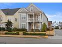 Two-story home with gray siding, red door, and front porch at 200 Jamestowne Pass, Peachtree City, GA 30269