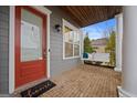 Front porch with a porch swing and brick flooring at 200 Jamestowne Pass, Peachtree City, GA 30269