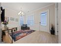 Living room with hardwood floors and a cozy sitting area at 200 Jamestowne Pass, Peachtree City, GA 30269