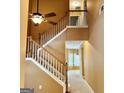 Carpeted staircase with wooden banister and neutral walls at 2567 Laurel Nw Cir, Atlanta, GA 30311