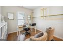 Bright home office with built-in shelves and hardwood floors at 361 Elkins Pl, Peachtree City, GA 30269
