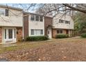 Two-story townhouses with mature trees and landscaping at 7122 Stonington Dr, Sandy Springs, GA 30328