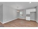Simple dining room with hardwood floors and white cabinets at 5316 Tolar Rd # 24, South Fulton, GA 30213
