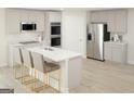 Modern kitchen with gray cabinets, stainless steel appliances, and an island at 5316 Tolar Rd # 24, South Fulton, GA 30213
