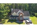 Two-story house with a large yard and driveway, seen from above at 245 Mckenzie Dr, Stockbridge, GA 30281