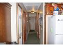 Long hallway with multiple doors and carpet at 7240 Colony Ln, Douglasville, GA 30135