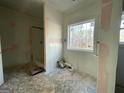 Under construction bathroom with shower and window at 4601 Parkwood Rd, Social Circle, GA 30025
