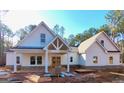 Newly constructed farmhouse style home with a large front yard at 4601 Parkwood Rd, Social Circle, GA 30025
