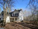 House exterior showcasing the front entrance and yard at 885 Laney Rd, Locust Grove, GA 30248