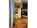 Hallway with hardwood floors, art, and a vintage record player at 898 Sw Oak Sw St # 3402, Atlanta, GA 30310