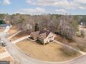 Two-story house aerial view, showing yard and driveway at 443 Abbey Pl, Villa Rica, GA 30180