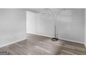 Bright living room with gray laminate floors at 151 Andover Dr, Jonesboro, GA 30238