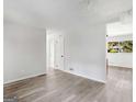 Open living area with gray floors and access to other rooms at 151 Andover Dr, Jonesboro, GA 30238