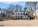 Gray two-story house with white trim and a landscaped yard at 2671 Eastmont Trl, Snellville, GA 30039