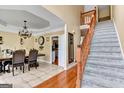 Elegant dining room with chandelier and hardwood floors at 4335 Burgomeister Pl, Snellville, GA 30039