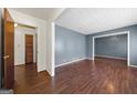 Hallway with hardwood floors and doors to other rooms at 241 Simon Ter, Atlanta, GA 30338