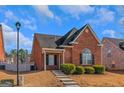 Brick ranch house with landscaping and a walkway at 625 Armitage Way, Stockbridge, GA 30281