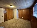Finished basement bedroom with wood paneling and carpet at 3780 Cedar Hurst Way, South Fulton, GA 30349