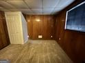Finished basement bedroom with wood paneling and carpet at 3780 Cedar Hurst Way, South Fulton, GA 30349