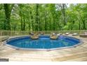 Relaxing above ground pool with wooden deck at 1081 Veltre Sw Cir, Atlanta, GA 30311