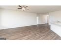 Spacious living room with hardwood floors and neutral wall colors at 435 Prescott Way, Villa Rica, GA 30180