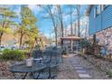 Cozy backyard patio with metal table and chairs and gazebo at 100 Traverse Ct, College Park, GA 30349