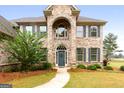 Two-story brick home with gray shutters and a grand entrance at 870 N Bethany Rd, Mcdonough, GA 30252